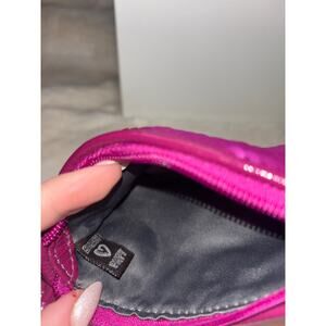 coach Poppy pink sequin wristlet
